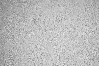 white wall paint with black round hole